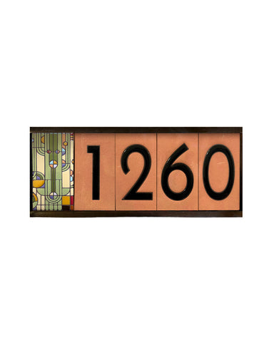 Decorative house number sign with '1260' on a white background
