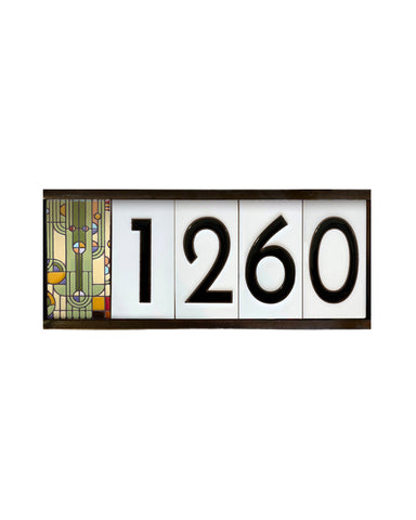 Decorative house number plate with '1260' on a white background
